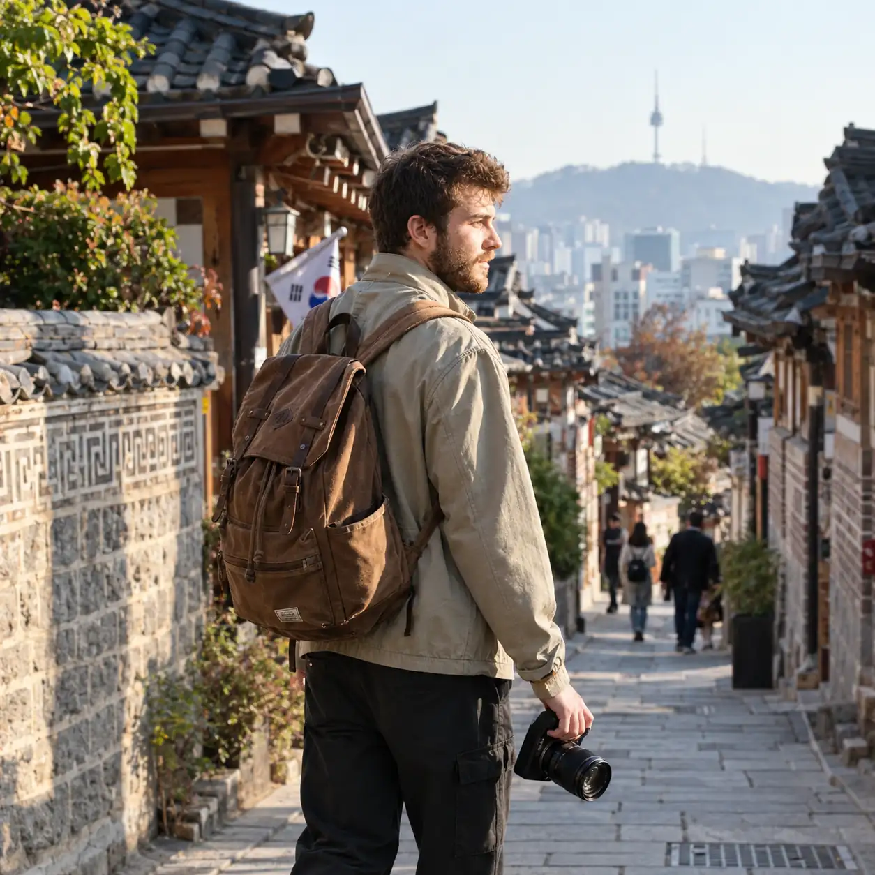 Alex Vance, founder of the Travel Tricks travel blog, exploring historic European streets with a backpack