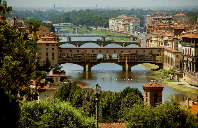 Florence 2 day itinerary historic Ponte Vecchio bridge arching over the Arno river