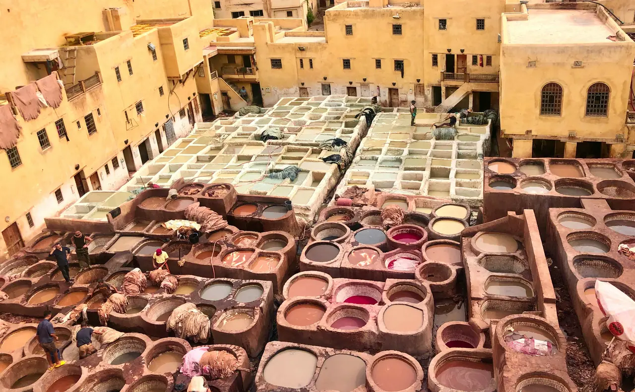Morocco travel guide shot of the Chouara tannery dye pits in Fez