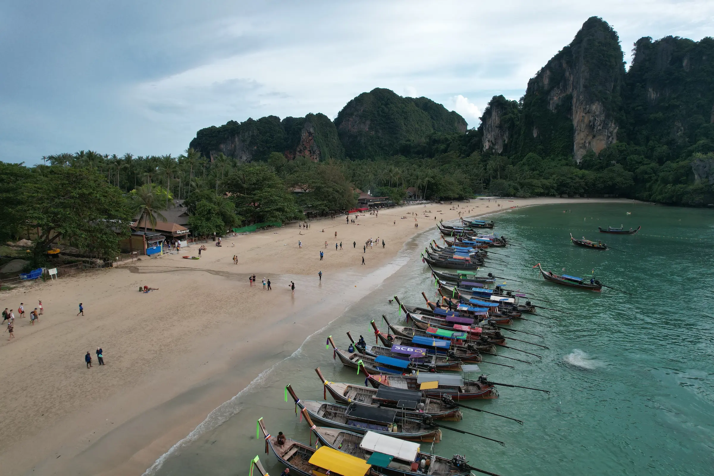 Longtail boats lined up on Railay Beach in Krabi near the end of 2 weeks in Thailand