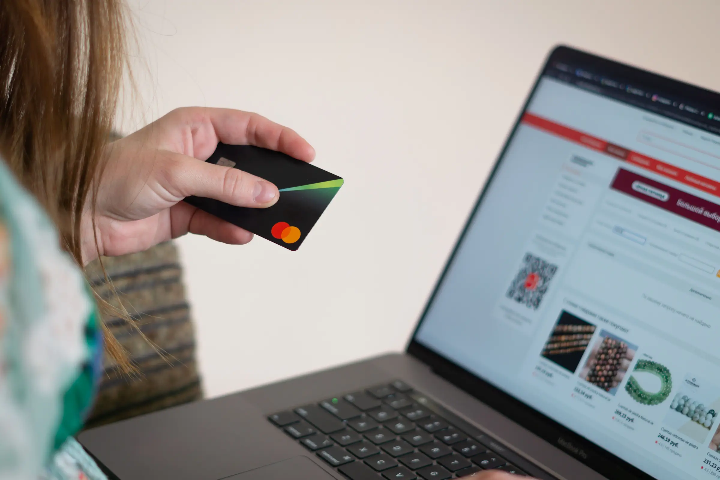 Traveler comparing airfares on a laptop to find the best day to buy plane tickets